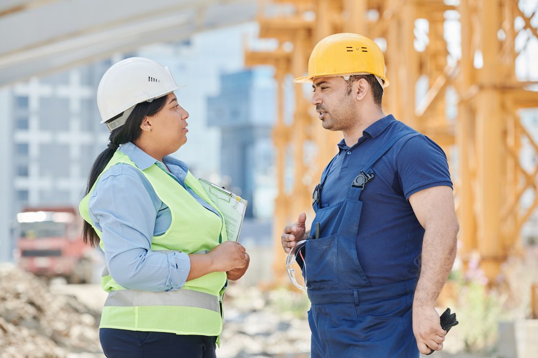 Civil construction professionals discussing work on site