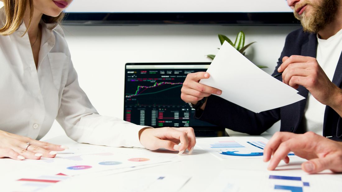 Business professionals reviewing financial information together